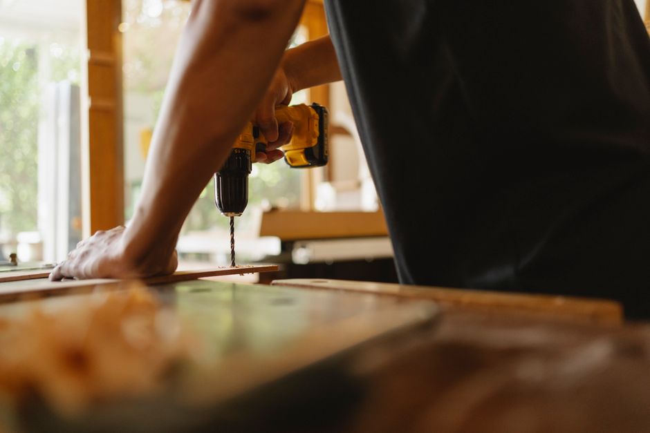 Master carpenter installing kitchen cabinets